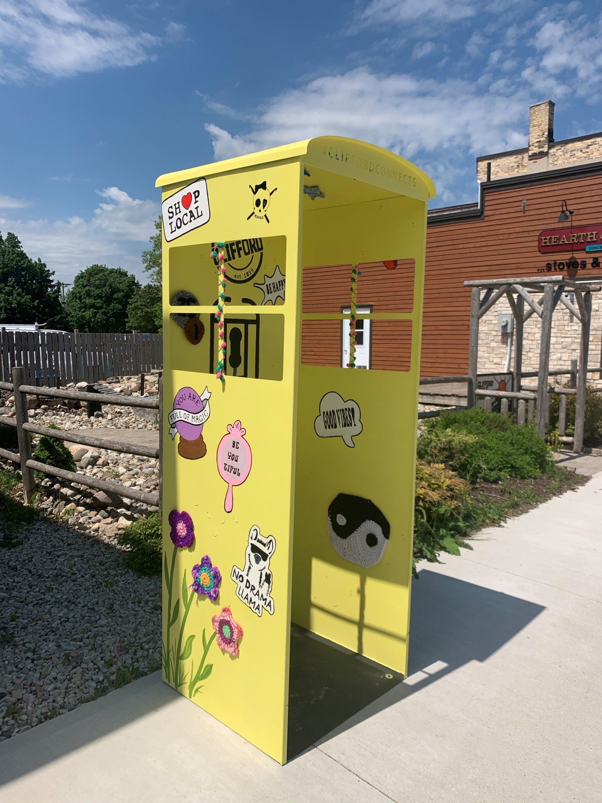 This booth was made for talking” mural – interactive art installation - yellow booth side