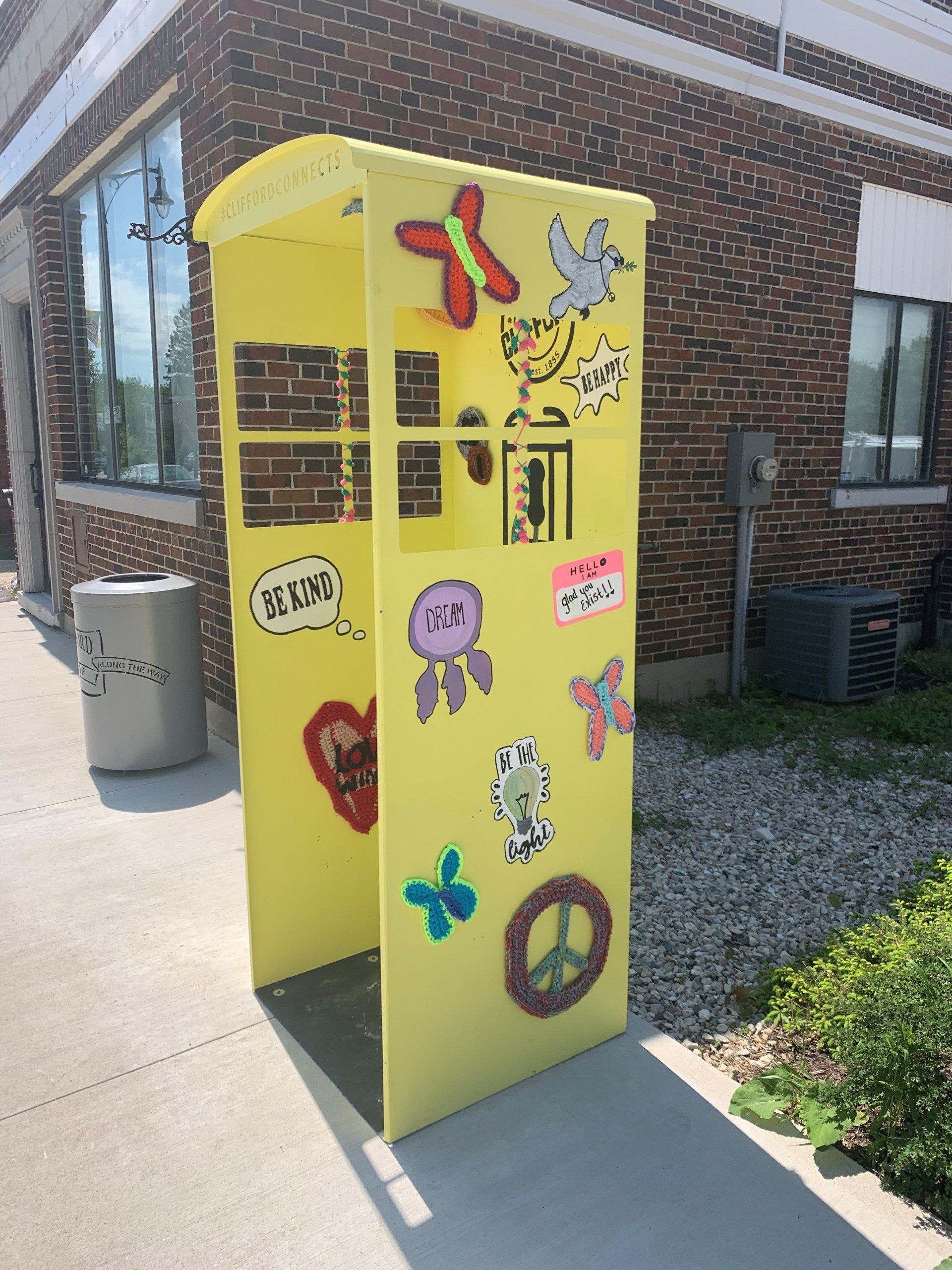 This booth was made for talking” mural – interactive art installation - yellow booth  side
