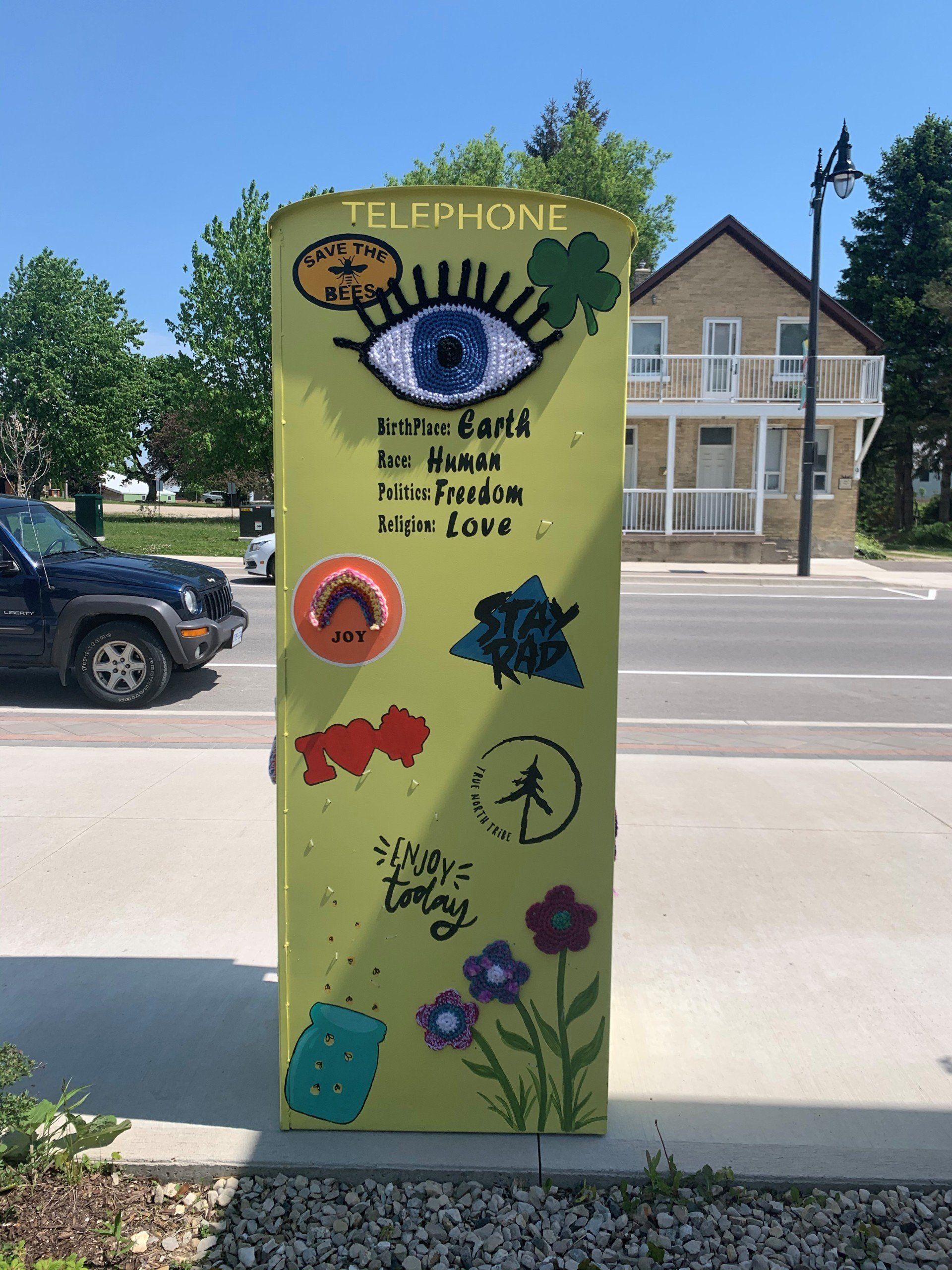 This booth was made for talking” mural – interactive art installation - yellow booth  back