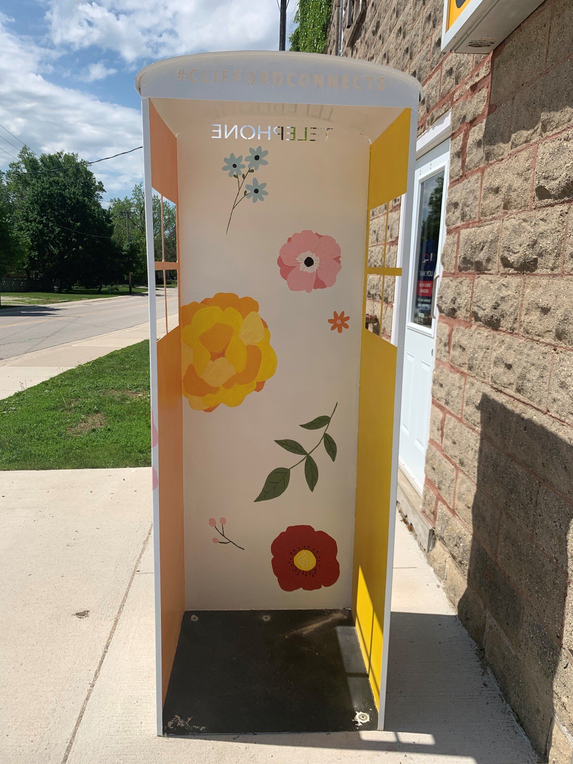 This booth was made for talking” mural – interactive art installation- white with flowers