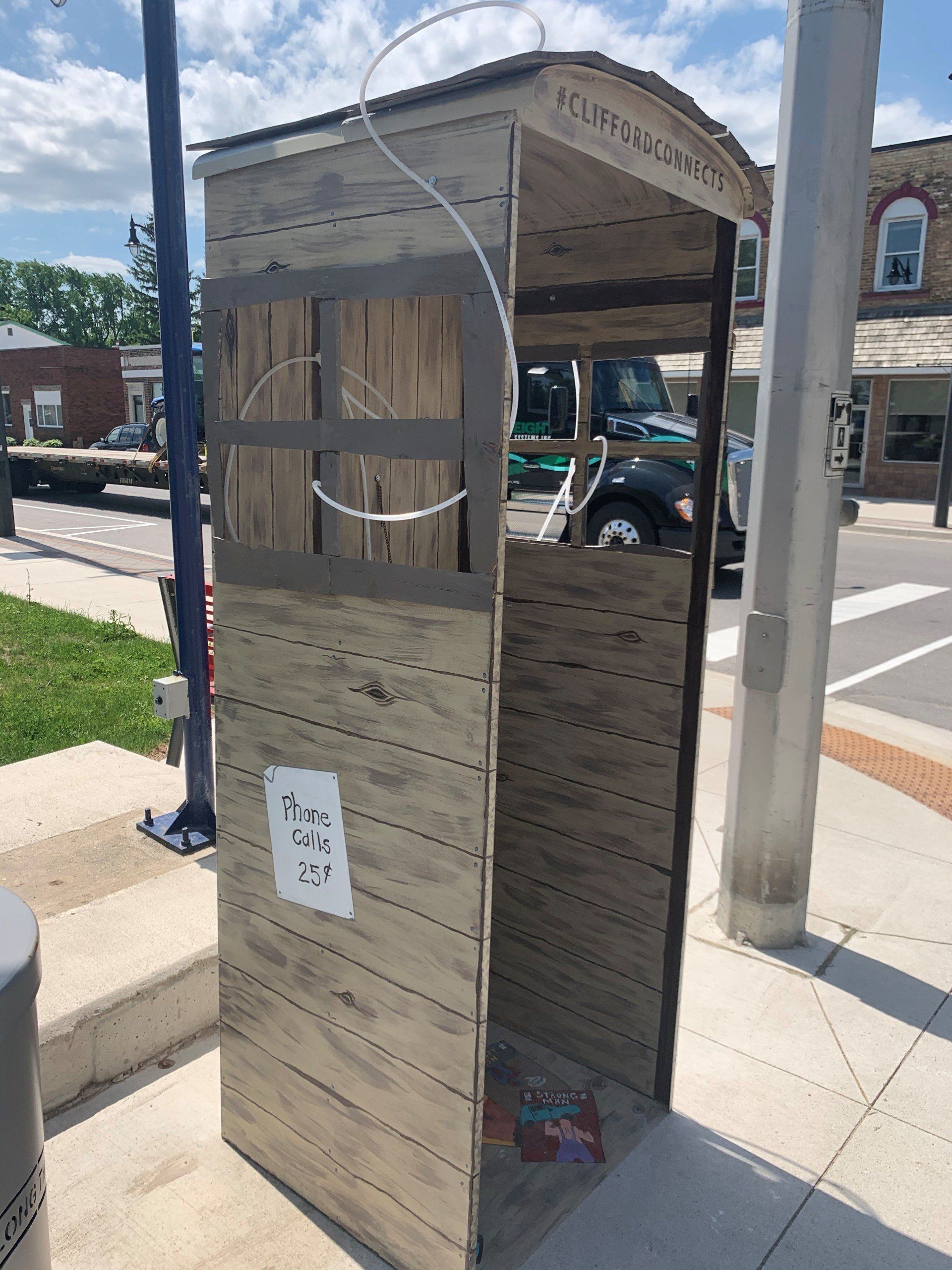 This booth was made for talking” mural – interactive art installation - wooden booth  side