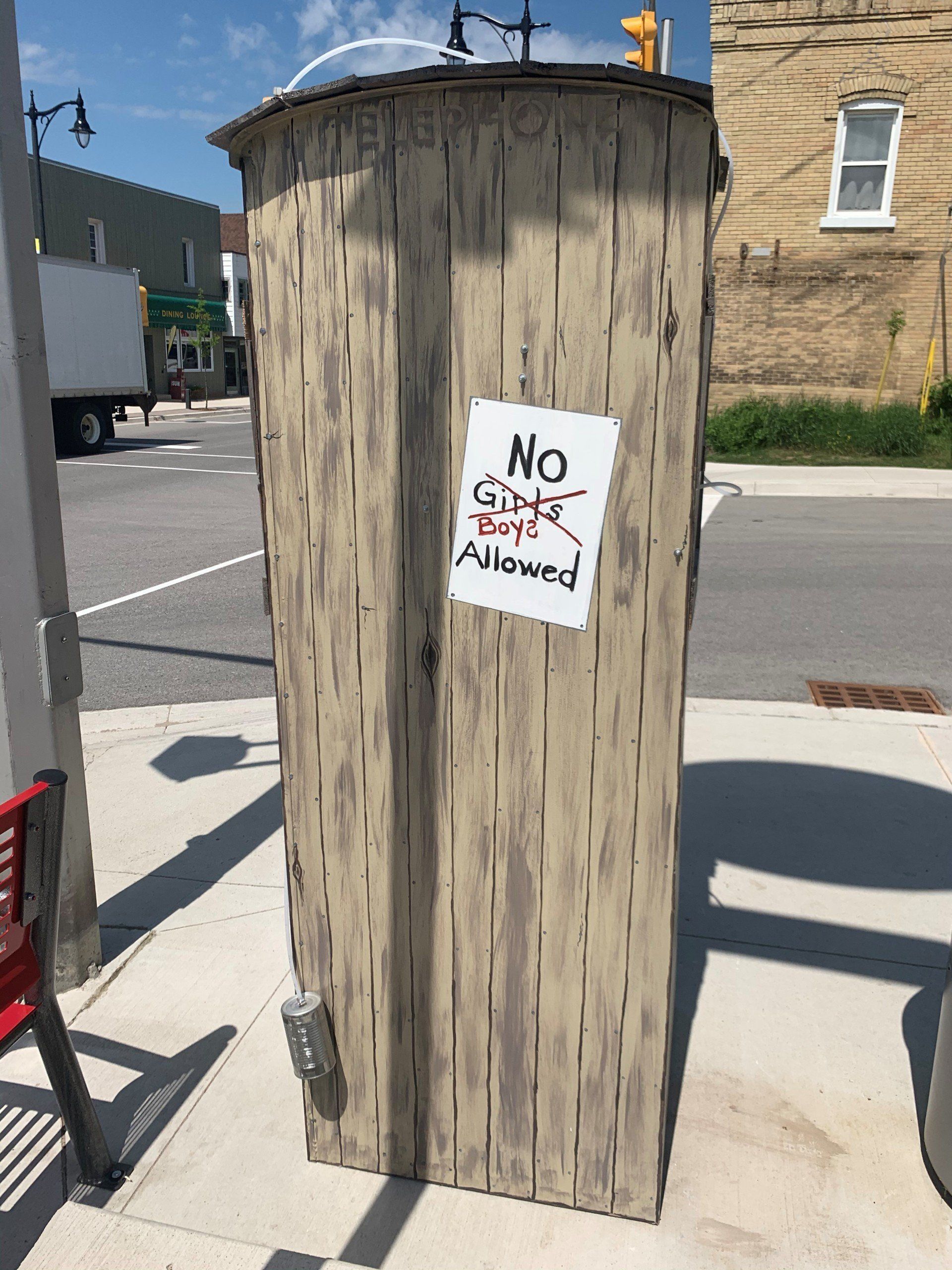 This booth was made for talking” mural – interactive art installation - wooden booth  back