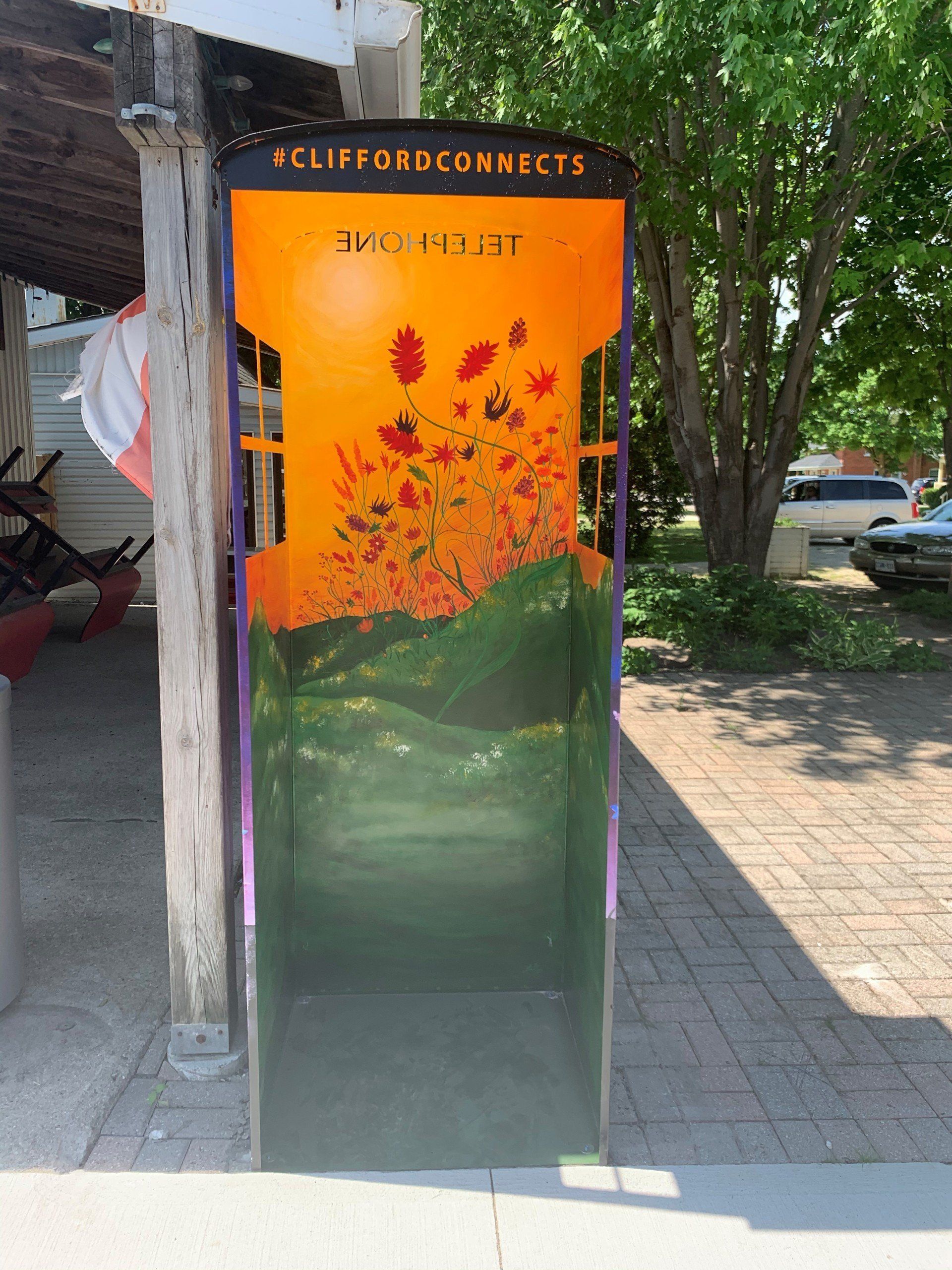 This booth was made for talking” mural – interactive art installation - orange flowers