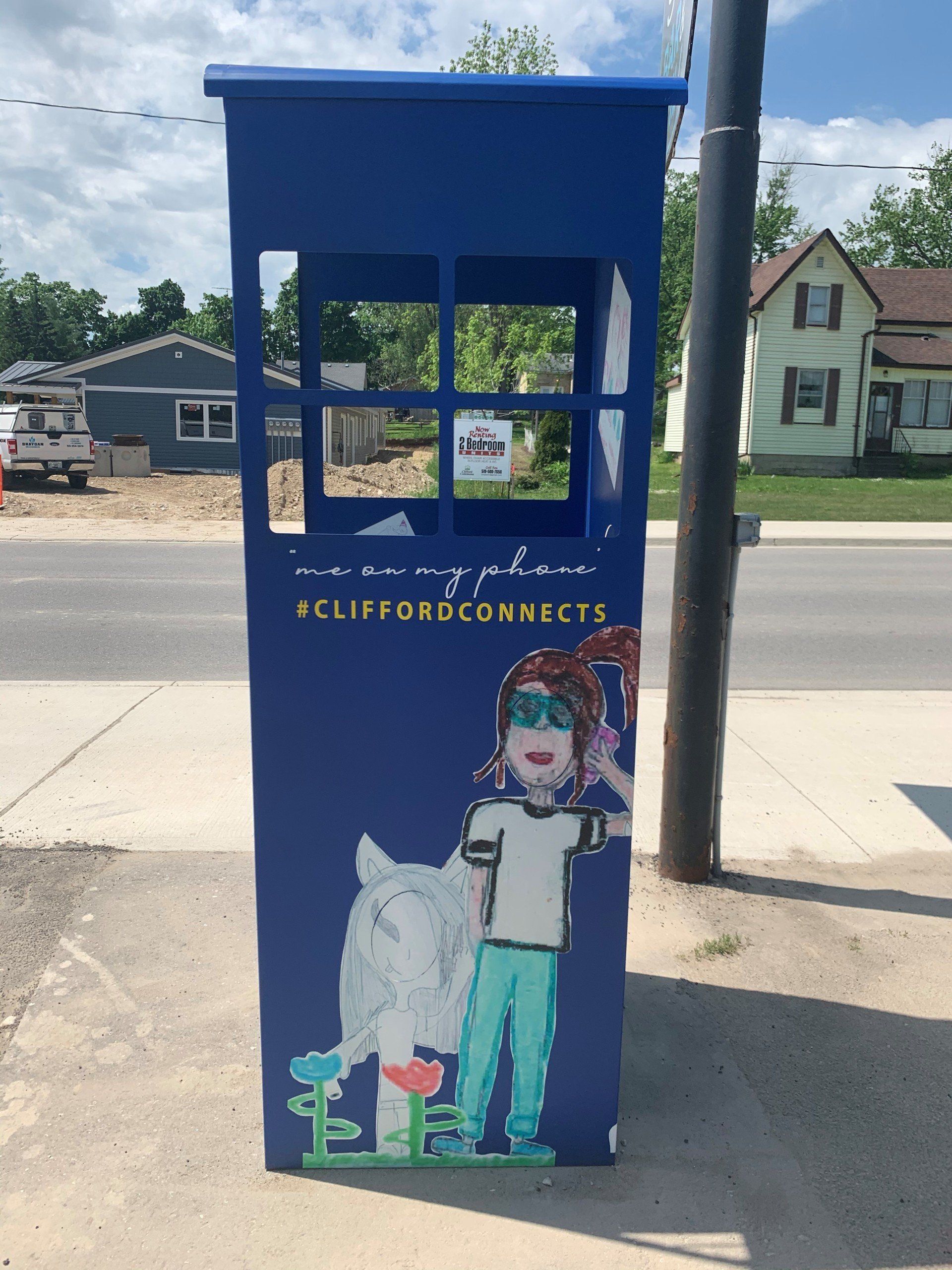 This booth was made for talking” mural – interactive art installation - blue booth  side