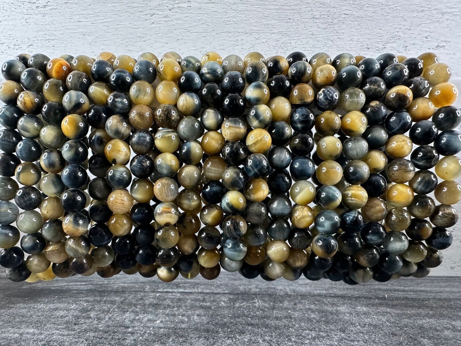 A bunch of beads are stacked on top of each other on a table.