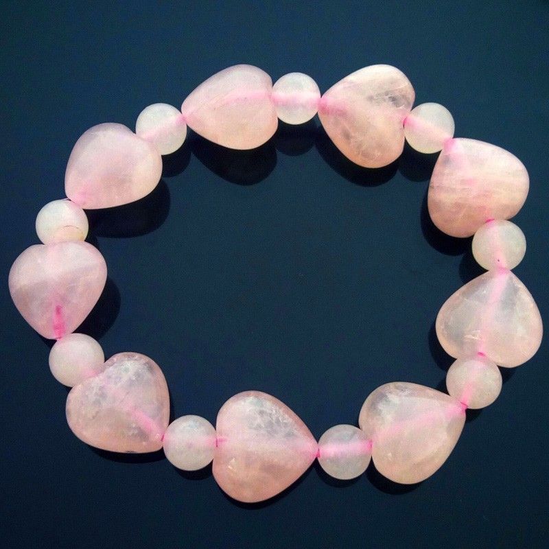 A bracelet made of pink and white heart shaped beads