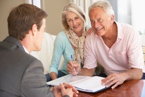 Businessman talking to older couple — Signal Mountain, TN — Trailhead Estate Planning