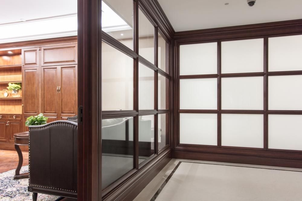 A Room With a Lot of Windows and a Couch in It — Headlands Glass in Ballina, NSW