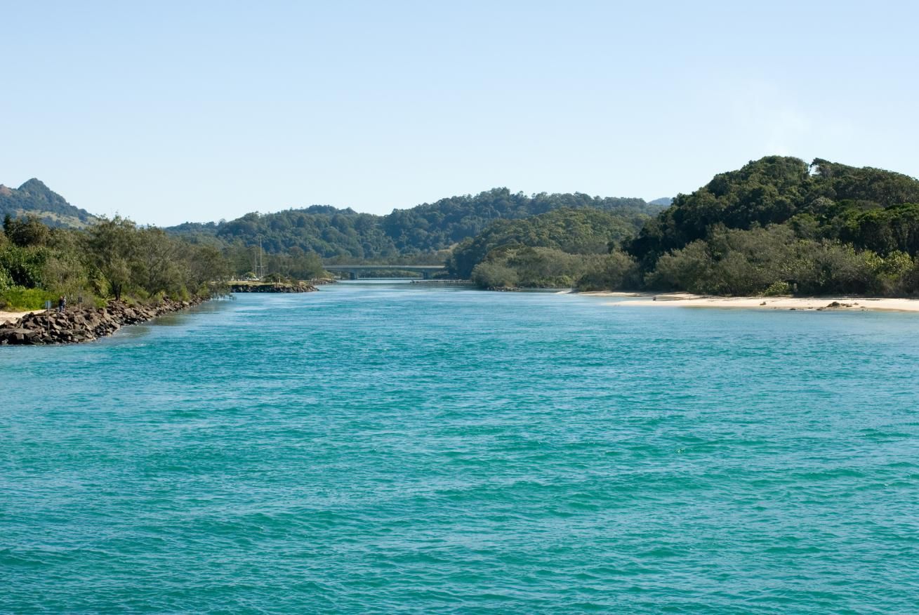 A River With Mountains in the Background and Trees on the Shore — Headlands Glass in Brunswick Heads, NSW