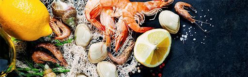 There are many different types of seafood on the table.