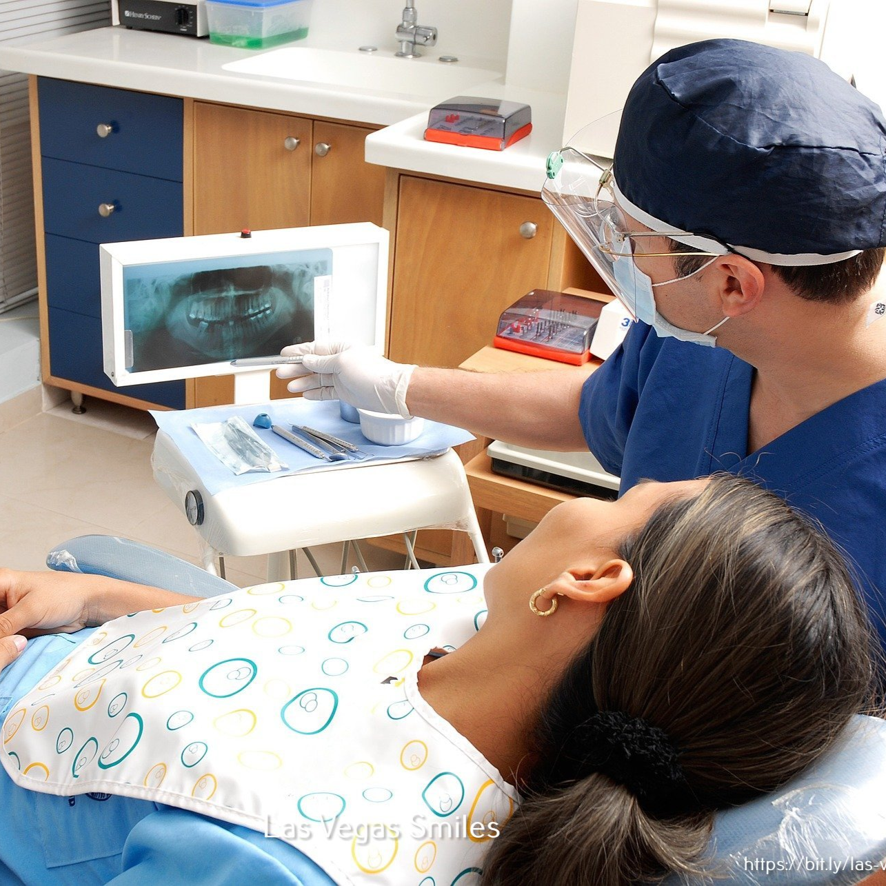 A professional orthodontist examines a patient receiving orthodonture services.