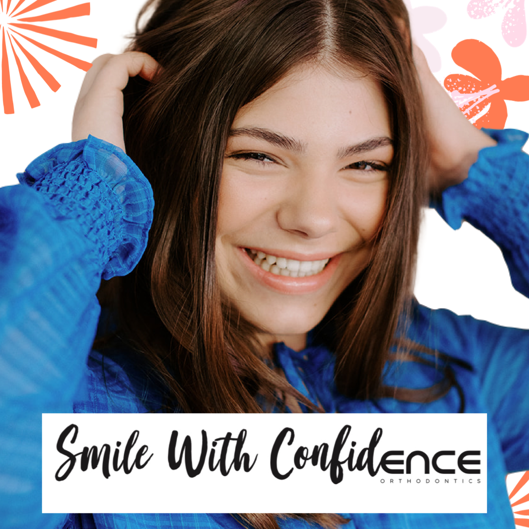 A woman in a blue shirt smiles with confidence
