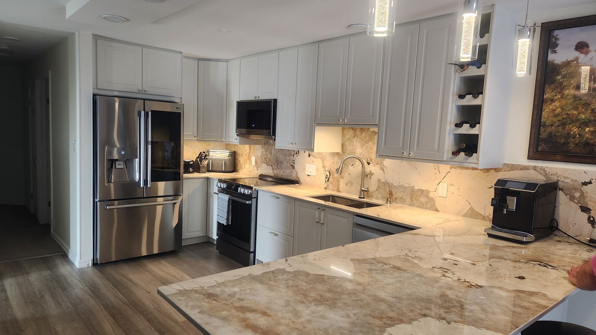 A kitchen with stainless steel appliances and granite counter tops