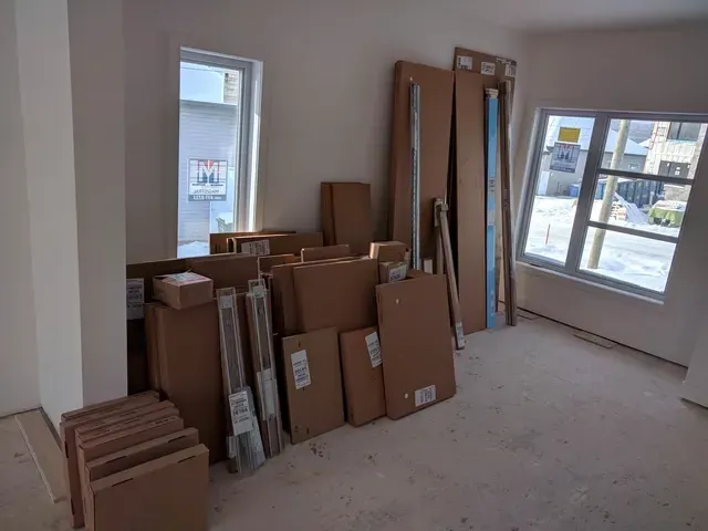 A room with a lot of cardboard boxes in it