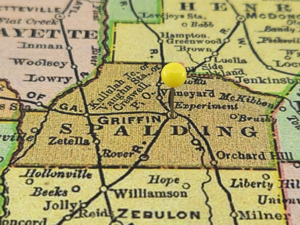 a yellow pin is pinned to a map of griffin 