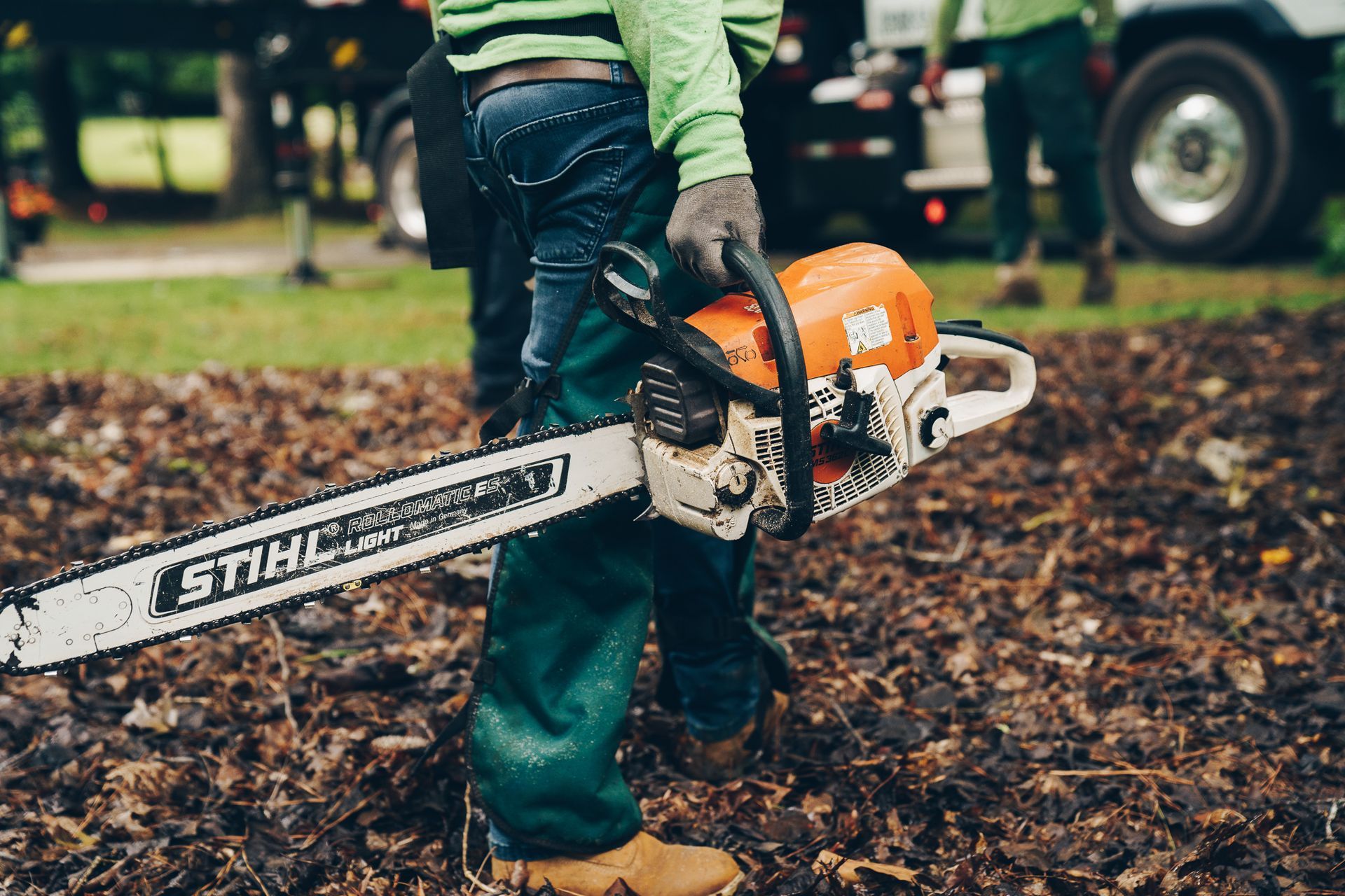 a stihl chainsaw is being held by a man
