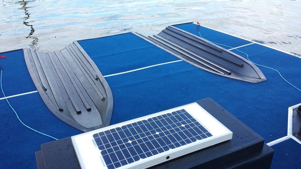 A Solar Panel is Sitting on Top of a Boat Dock — V.I.P. Plastic Fabrication in Townsville, QLD