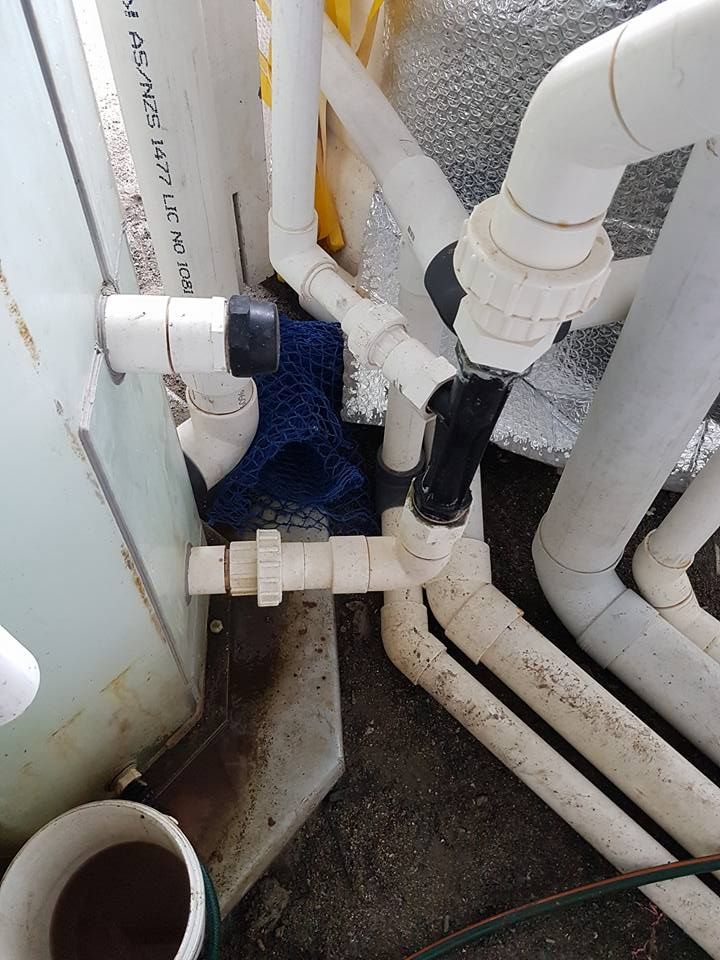 A Bunch of White Pipes Are Connected to a Wall — V.I.P. Plastic Fabrication in Portsmith, QLD