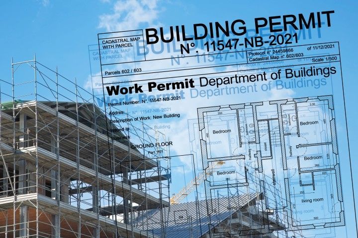 Building permit overlaying a construction site and architectural plans.