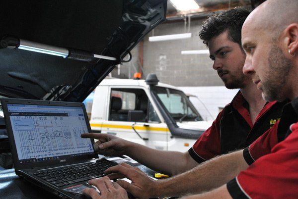 brad and jay working in engine