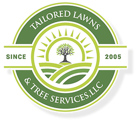 A logo for tailored lawns and tree services llc