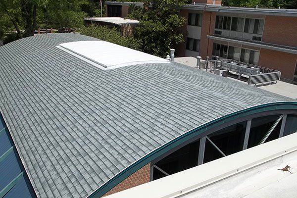 Building With Roof Shingles And Brick Wall — Candler, NC — ARS Construction Service