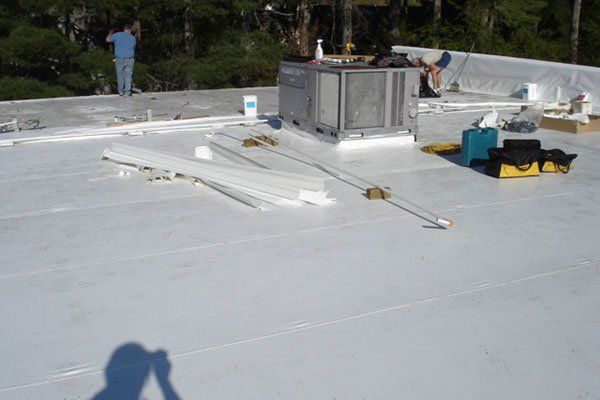 Workers Working On The Flat Roof — Candler, NC — ARS Construction Service
