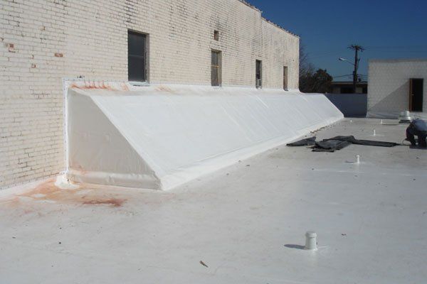 Flat Roof With Brick Wall — Candler, NC — ARS Construction Service