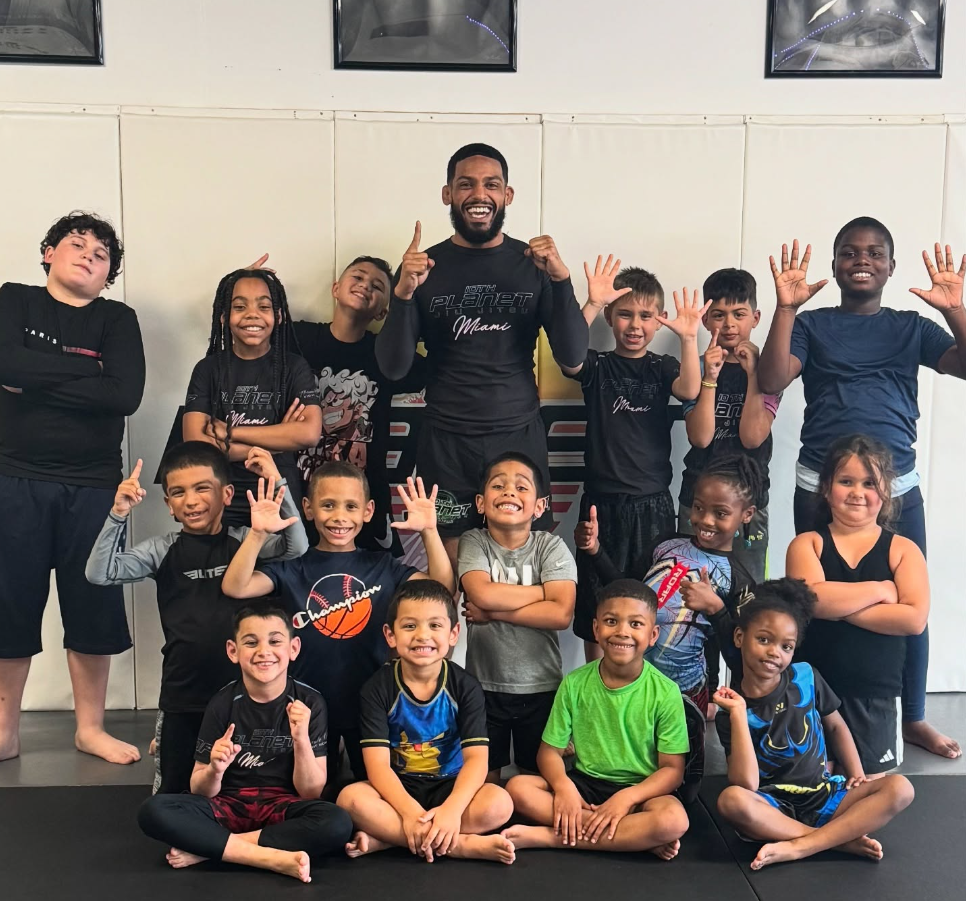 Kids practicing controlled grappling in a Youth Jiu-Jitsu class at 10th Planet Jiu-Jitsu Miami.