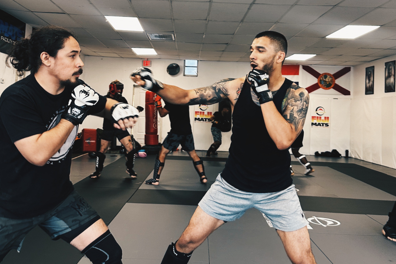 Adults practicing no-gi grappling at 10th Planet Jiu-Jitsu Miami in Miramar, FL.