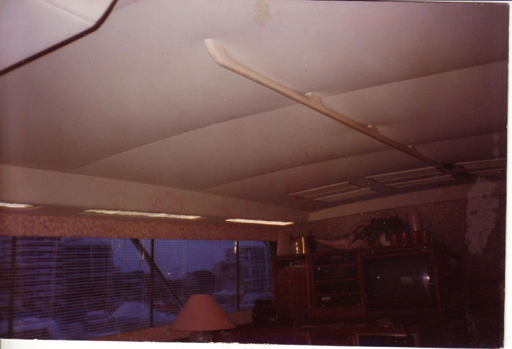 A picture of a living room with a lamp and a window