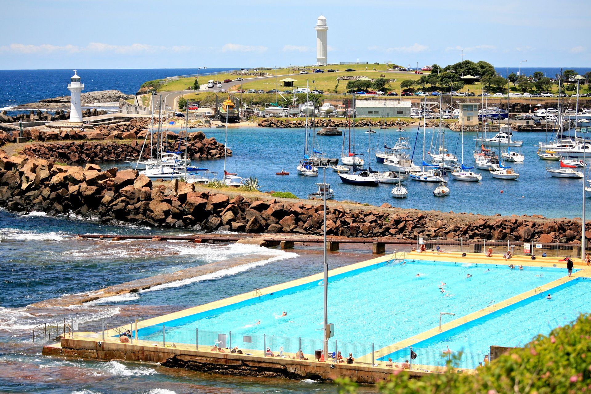 A large swimming pool in the middle of a body of water