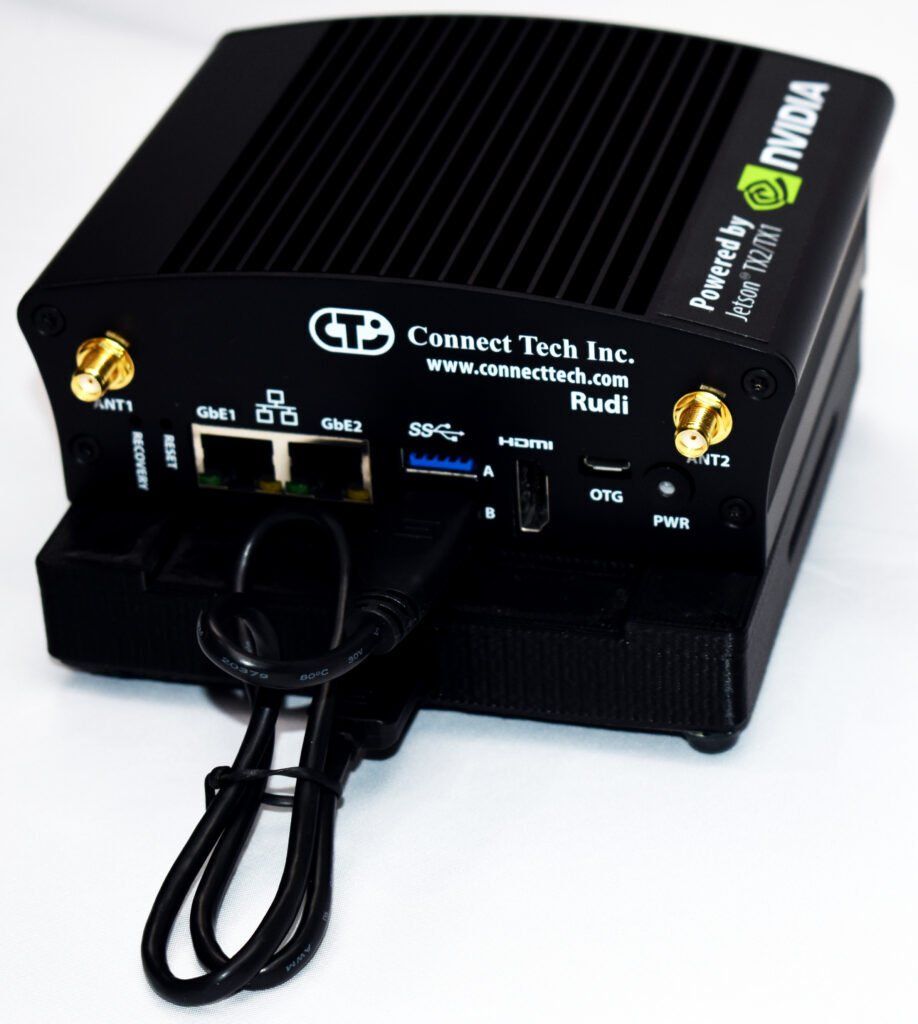 A black nvidia device with a cord attached to it