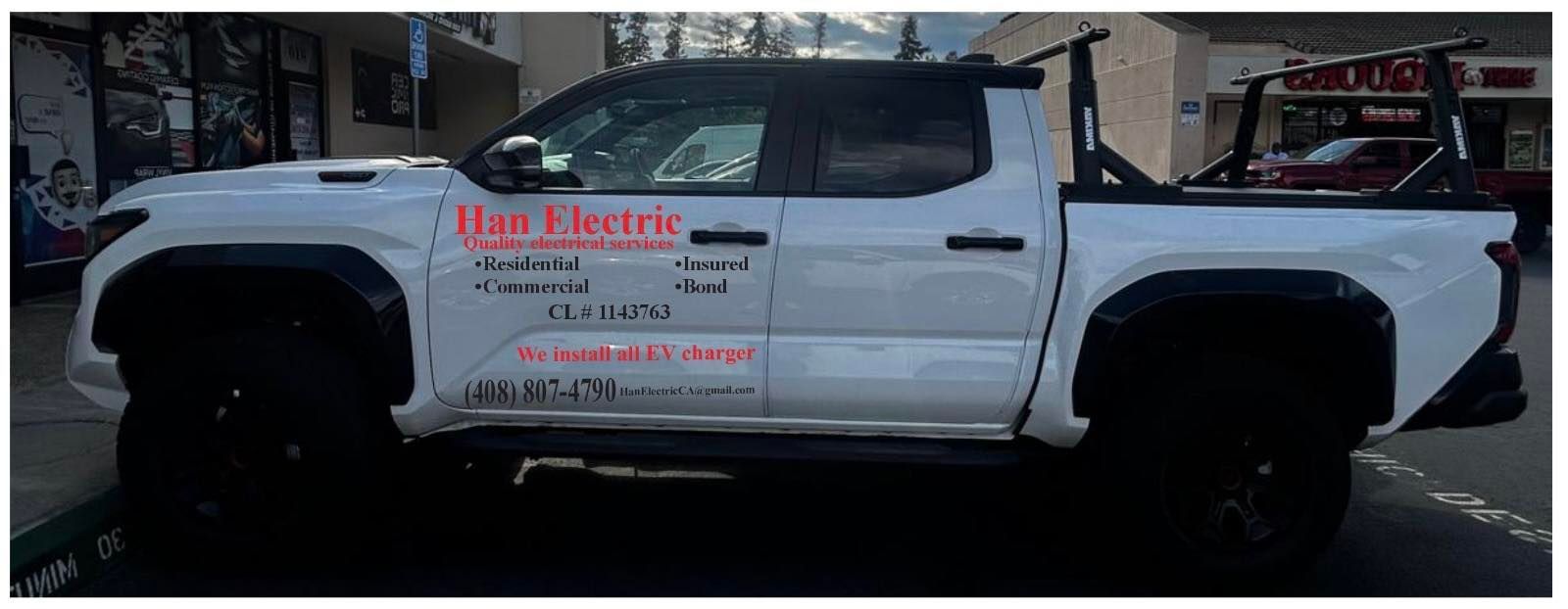White pickup truck with black trim, labeled 
