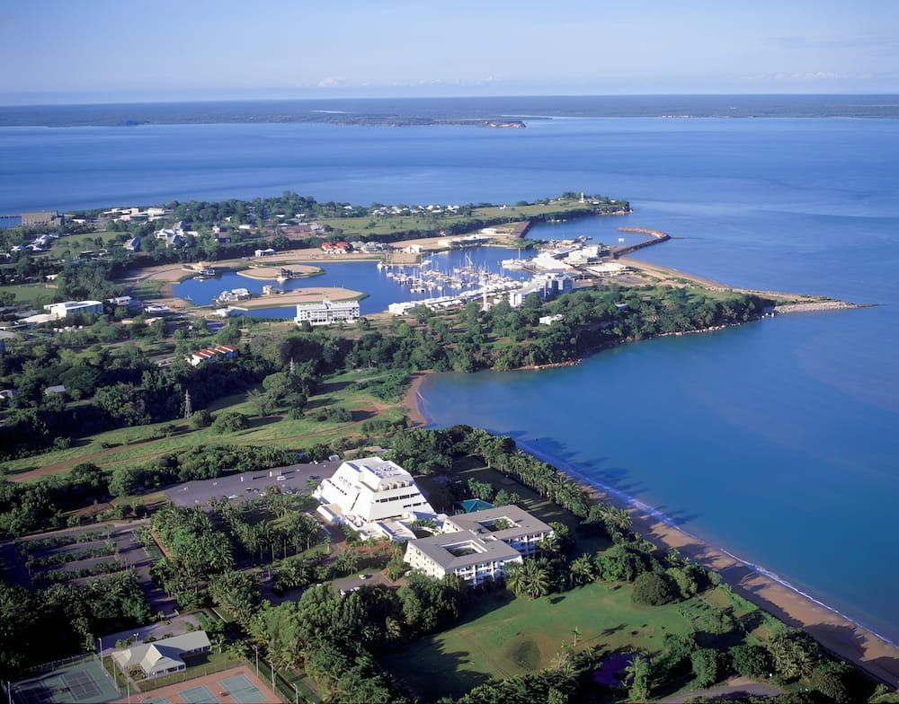 Aerial View of a Coastal Town With a Marina, Buildings and Green Areas — KNG Roofing And Construction in Maningrida, NT