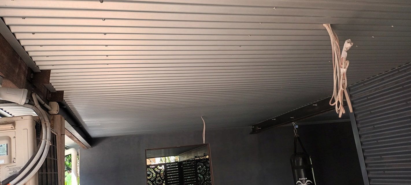Inside a Room With a Corrugated Metal Ceiling — KNG Roofing And Construction in Darwin, NT