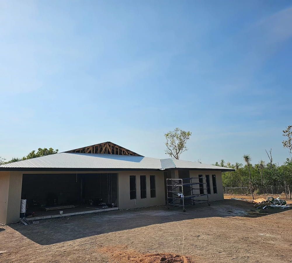 A House Under Construction With a Light Blue Sky Overhead — KNG Roofing And Construction in Palmerston, NT