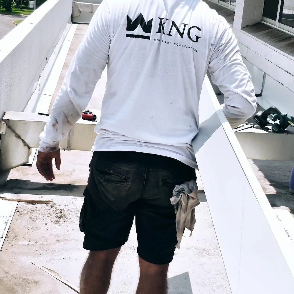 Man Walking on a Rooftop — KNG Roofing And Construction in Darwin, NT