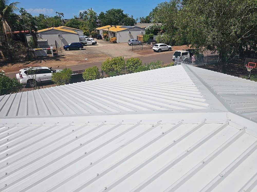 View From a White Metal Roof With Surrounding Buildings — KNG Roofing And Construction in Darwin, NT