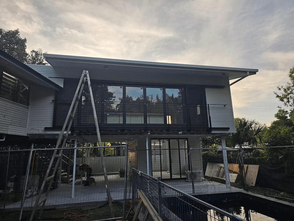Grey and White Exterior, Cloudy Sky — KNG Roofing And Construction in Darwin, NT