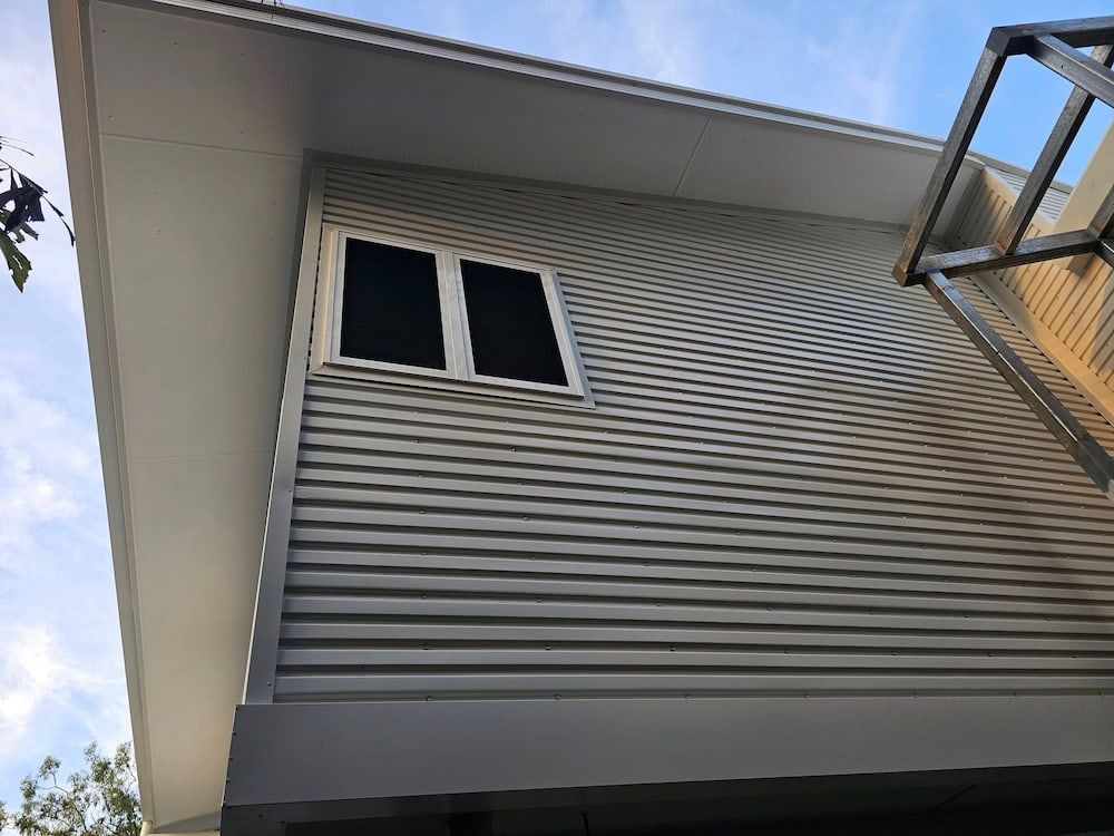 Building Exterior With Horizontal Siding and Window — KNG Roofing And Construction in Tennant Creek, NT