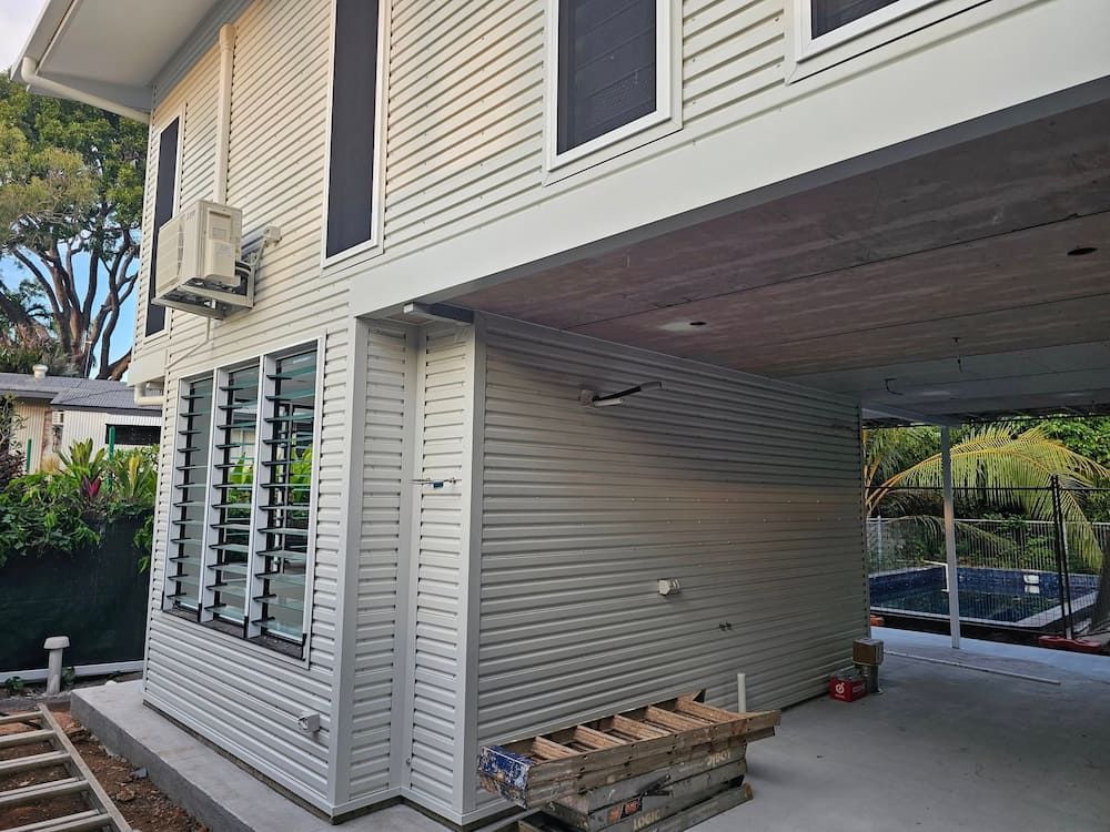 Construction Materials Piled in Carport — KNG Roofing And Construction in Darwin, NT