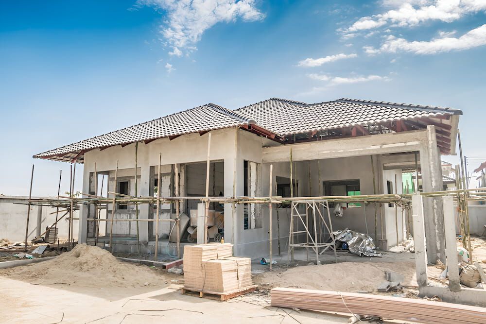 House Under Construction; Concrete Walls and Scaffolding — KNG Roofing And Construction in Palmerston, NT