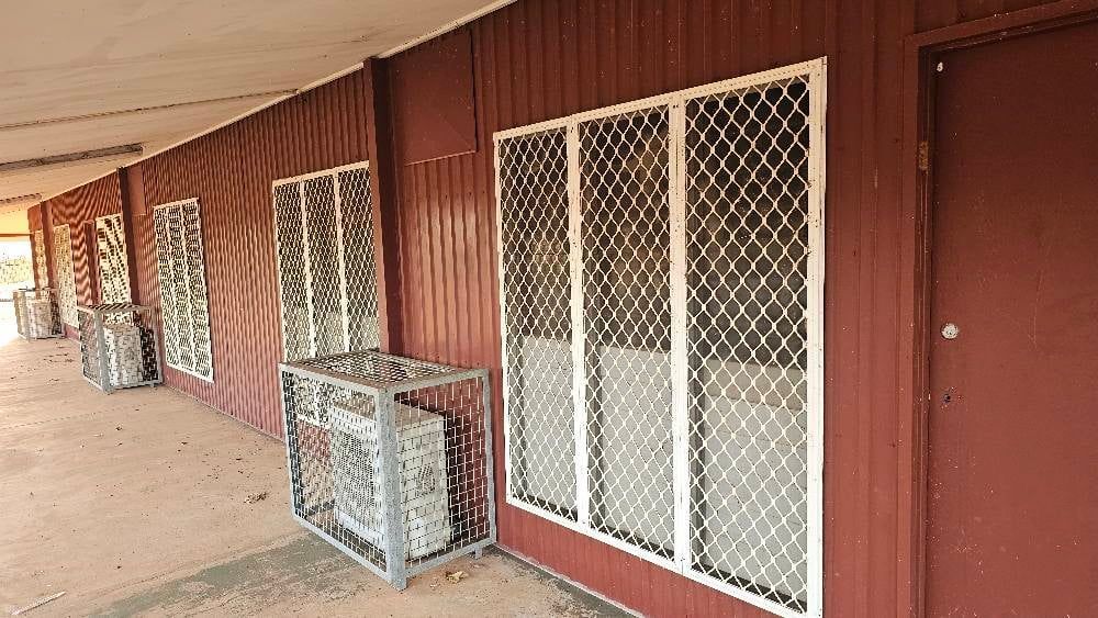Extensions of a Reddish-brown Building With Windows and Ac Units — KNG Roofing And Construction in Katherine, NT