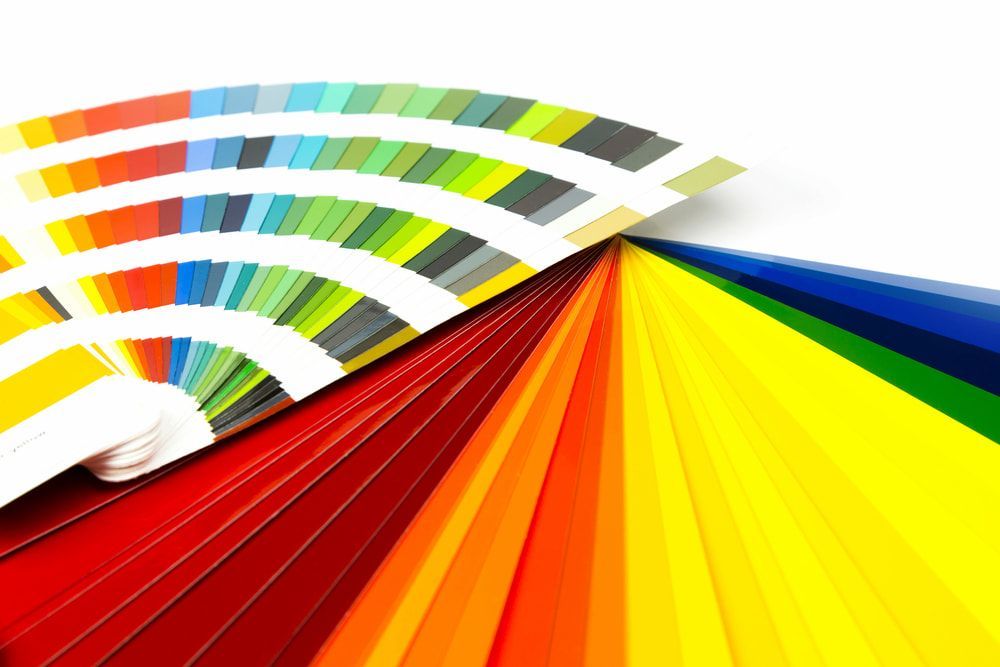 Colour Swatches Fanned Out, Showcasing a Wide Spectrum of Hues From Red to Blue — KNG Roofing And Construction in Darwin, NT