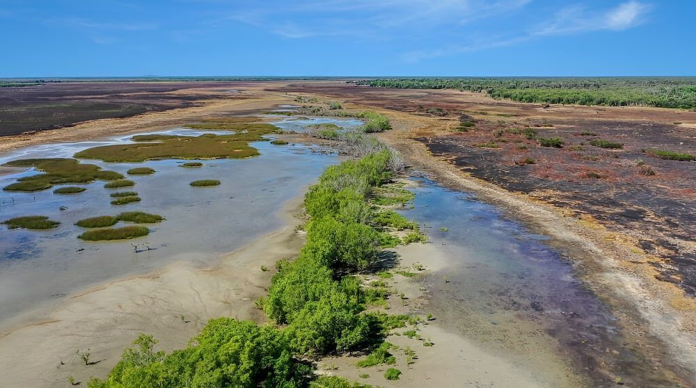 Aerial View of a Wetland With Water Channels — KNG Roofing And Construction in Humpty Doo, NT