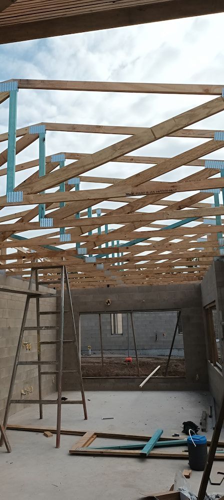 Construction Site With Wooden Roof Structure and Ladder — KNG Roofing And Construction in Darwin, NT