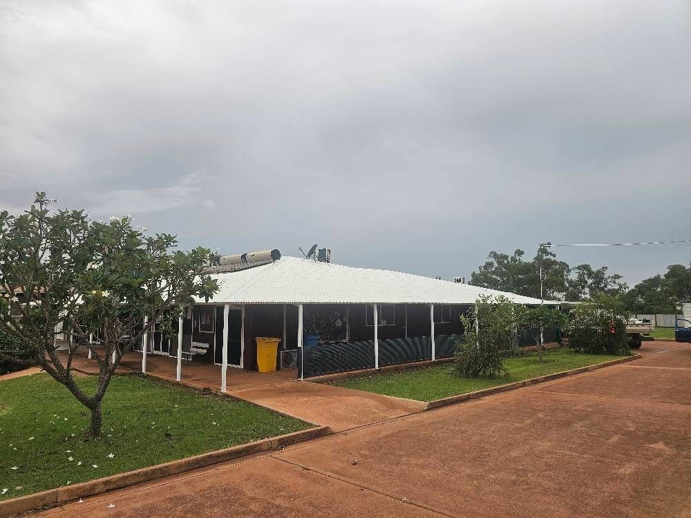 A Building With A White Roof — KNG Roofing And Construction in Borroloola, NT