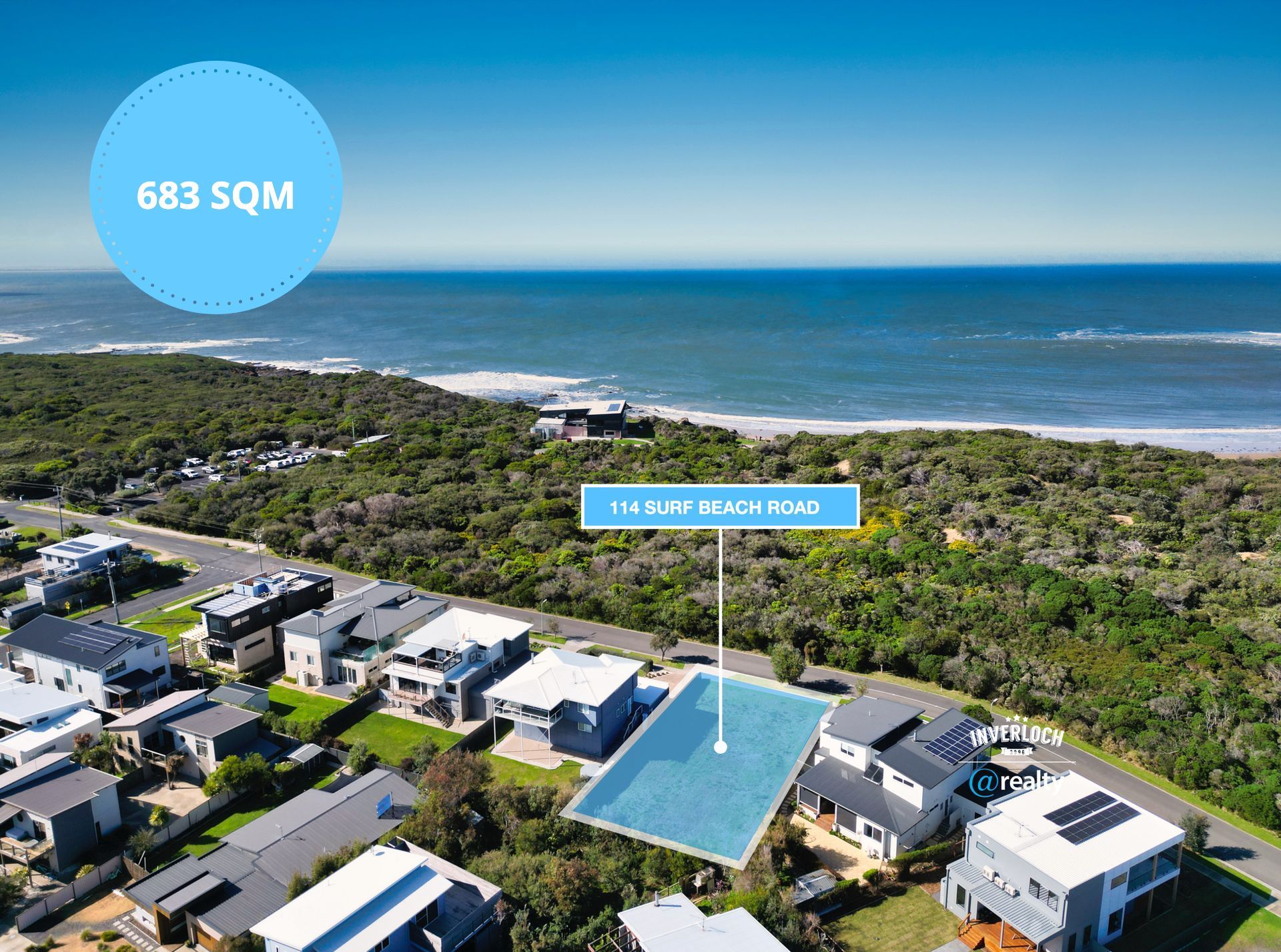 An aerial view of a residential area next to the ocean