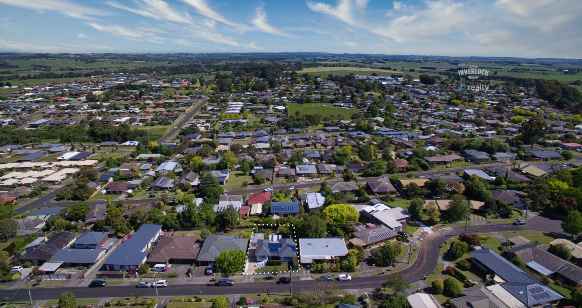 An aerial view of a residential area with lots of houses and trees.